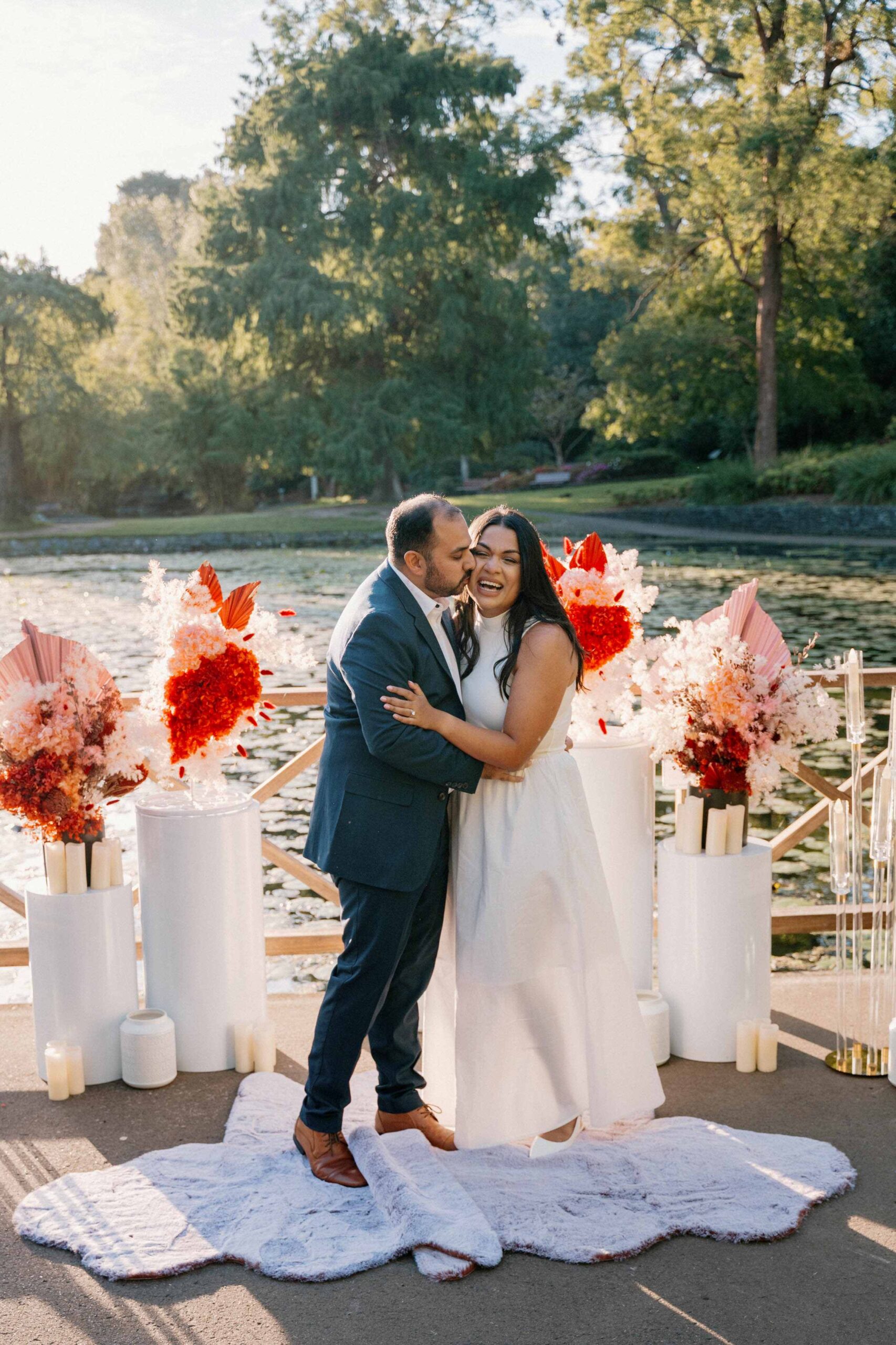 happiness shared with couples big smiles after the very romantic surprise proposal